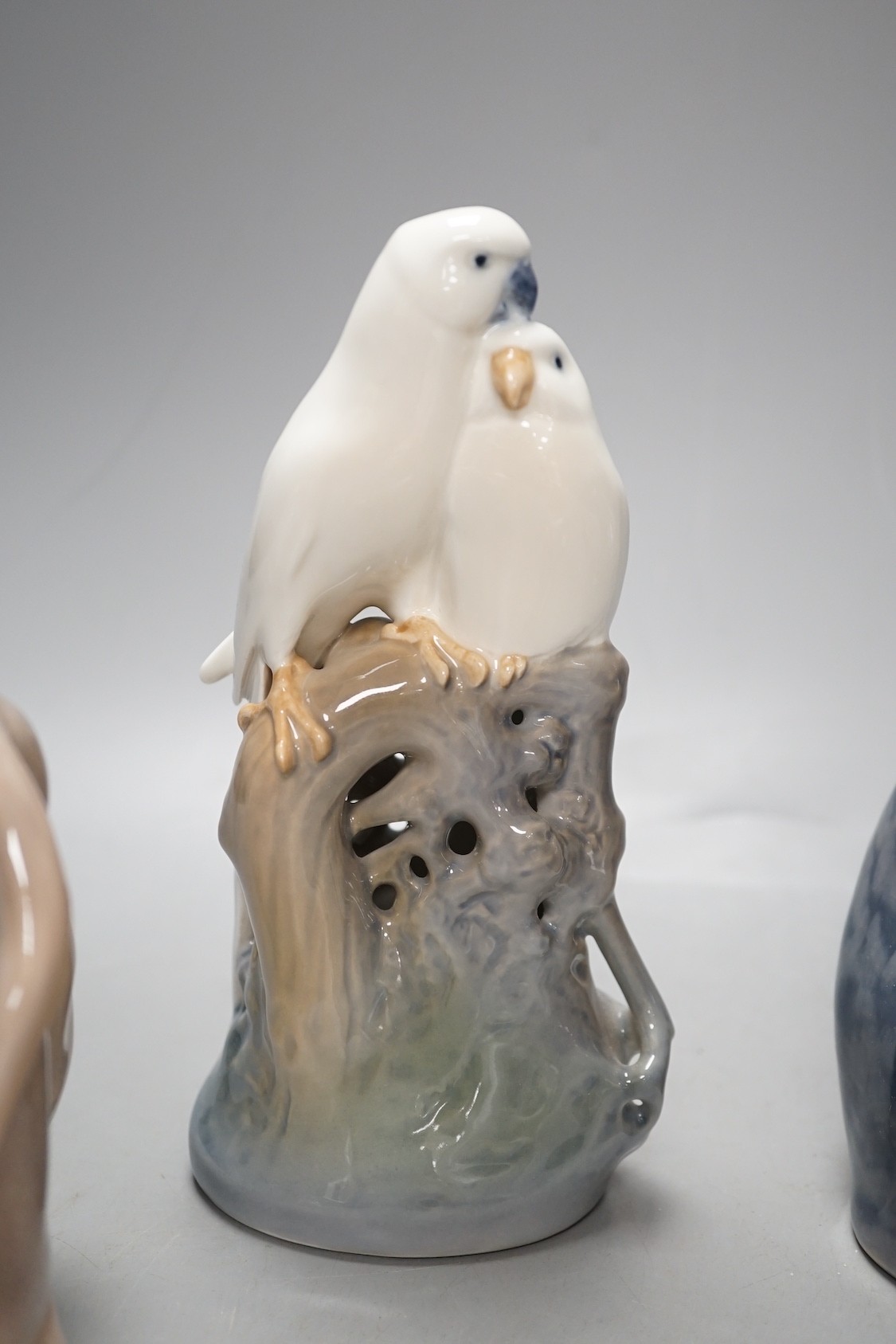 A Royal Copenhagen cat 304, love birds 649, dove 4727, a Lladro dog's head and a Nao figure of a yawning dog - tallest 19cm (5)
